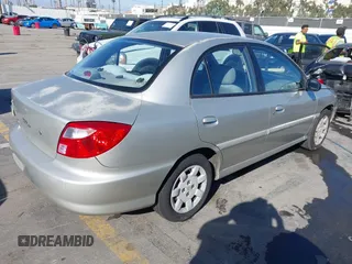 2002 Kia Rio with VIN KNADC123X26183989, listed as a IAAI auction lot 41837792 with 116,746 mi miles. Bid and sale history available at carsss.com. Image 4.