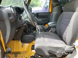 2012 Jeep Wrangler Sport with VIN 1C4AJWAG6CL247929, listed as a Copart auction lot 58942515 with 113,833 mi miles and Salvage title. Bid and sale history available at DreamBid. Image 7.