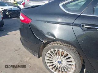 2014 Ford Fusion Titanium with VIN 3FA6P0K94ER115795, listed as a IAAI auction lot 42230295 with 266,277 mi miles and . Bid and sale history available at DreamBid. Image 14.