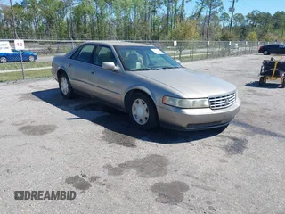 2001 Cadillac Seville Luxury SLS z VIN 1G6KS54Y71U206896, wystawiony jako IAAI lot #41875053 z przebiegiem 143 471 mil mil oraz . Historia ofert i sprzedaży dostępna na DreamBid. Obrazek 1.
