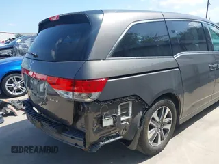 2014 Honda Odyssey Touring with VIN 5FNRL5H99EB075979, listed as a IAAI auction lot 42520154 with 99,314 mi miles and . Bid and sale history available at DreamBid. Image 20.