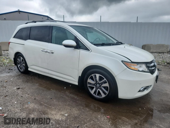 2014 Honda Odyssey Touring with VIN 5FNRL5H95EB083772, listed as a Copart auction lot 56713525 with 215,833 mi miles and Salvage title. Bid and sale history available at DreamBid. Image 4.
