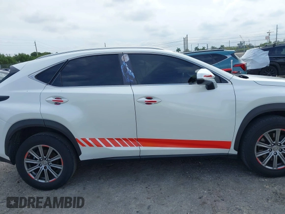 2015 Lexus NX 200t with VIN JTJYARBZ1F2018047, listed as a IAAI auction lot 41633876 with 154,396 mi miles. Bid and sale history available at carsss.com. Image 13.