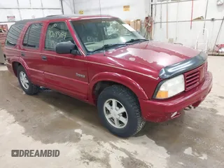 1999 Oldsmobile Bravada z VIN 1GHDT13W9X2701952, wystawiony jako IAAI lot #42093184 z przebiegiem 121 532 mil mil oraz . Historia ofert i sprzedaży dostępna na DreamBid. Obrazek 1.