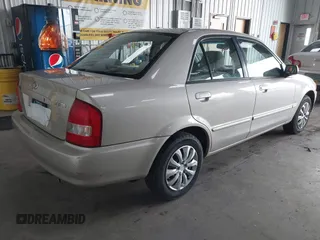2000 Mazda Protege DX with VIN JM1BJ2221Y0239987, listed as a IAAI auction lot 42092488 with 140,756 mi miles and . Bid and sale history available at DreamBid. Image 4.