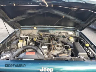 1998 Jeep Cherokee Sport with VIN 1J4FT68S2WL236774, listed as a Copart auction lot 77388734 with 128,591 mi miles and Clean Title. Bid and sale history available at carsss.com. Image 11.