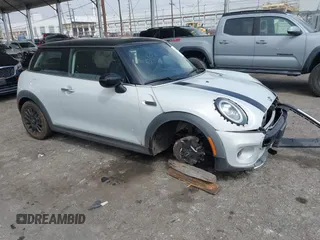 2021 MINI Hardtop Cooper with VIN WMWXR3C09M2N96671, listed as a IAAI auction lot 42031023 with 12,450 mi miles and . Bid and sale history available at DreamBid. Image 1.