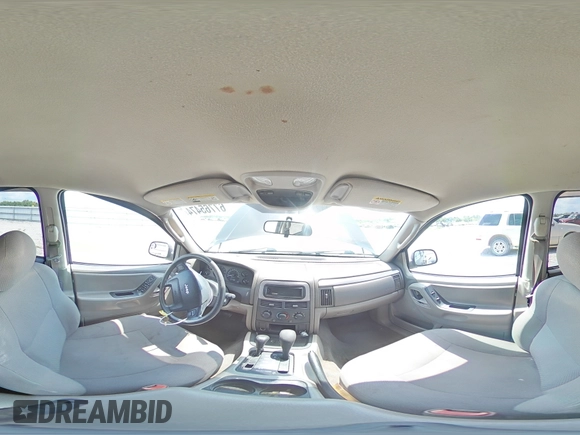 2004 Jeep Grand Cherokee Laredo with VIN 1J4GW48S64C121057, listed as a Copart auction lot 67765474 with 166,359 mi miles and Salvage title. Bid and sale history available at DreamBid. Image 14.