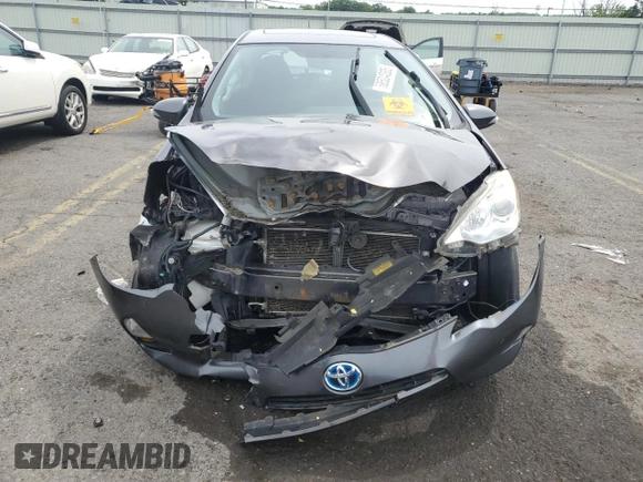 2014 Toyota Prius One z VIN JTDKDTB33E1066355, wystawiony jako Copart lot #58524285 z przebiegiem Nie podano mil oraz Szkoda całkowita • Salvage title. Historia ofert i sprzedaży dostępna na DreamBid. Obrazek 5.