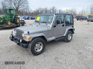 2001 Jeep Wrangler Sport z VIN 1J4FA49S31P349269, wystawiony jako IAAI lot #41427014 z przebiegiem 112 421 mil mil oraz . Historia ofert i sprzedaży dostępna na DreamBid. Obrazek 2.