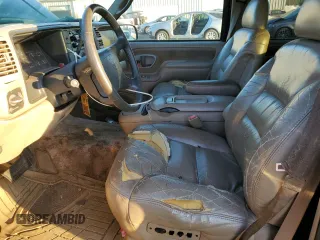 1997 GMC Suburban with VIN 3GKFK16RXVG513571, listed as a Copart auction lot 82086924 with 190,142 mi miles and Salvage title. Bid and sale history available at DreamBid. Image 7.