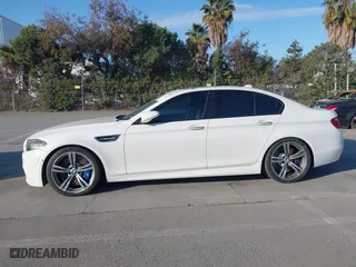 2014 BMW M5 with VIN WBSFV9C55ED593614, listed as a IAAI auction lot 41777369 with 144,076 mi miles. Bid and sale history available at carsss.com. Image 14.