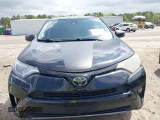 2018 Toyota RAV4 XLE with VIN 2T3RFREV1JW697044, listed as a IAAI auction lot 41891412 with 140,145 mi miles. Bid and sale history available at carsss.com. Image 13.
