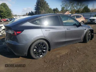 2023 Tesla Model Y Long Range z VIN 7SAYGAEE3PF596826, wystawiony jako Copart lot #50513045 z przebiegiem 30 747 mil mil oraz Szkoda całkowita • Salvage title. Historia ofert i sprzedaży dostępna na DreamBid. Obrazek 3.