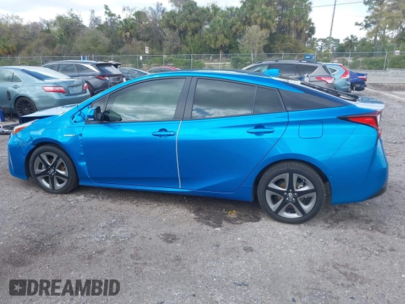 2022 Toyota Prius L Eco with VIN JTDKAMFU5N3165006, listed as a IAAI auction lot 41753470 with 33,567 mi miles and . Bid and sale history available at DreamBid. Image 14.