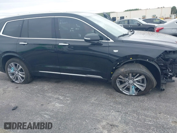 2023 Cadillac XT6 FWD Premium Luxury with VIN 1GYKPCRS6PZ106284, listed as a IAAI auction lot 41595617 with 32,795 mi miles and . Bid and sale history available at DreamBid. Image 19.