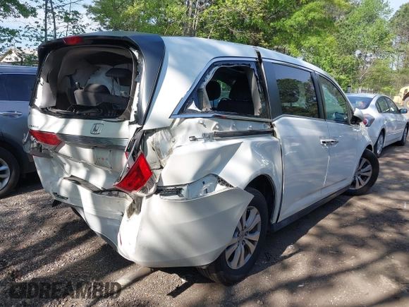 2014 Honda Odyssey EX-L with VIN 5FNRL5H63EB064854, listed as a IAAI auction lot 42102704 with 148,536 mi miles and . Bid and sale history available at carsss.com. Image 4.