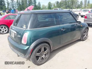 2005 MINI Hardtop with VIN WMWRC334X5TC59101, listed as a IAAI auction lot 42467671 with 180,264 mi miles and . Bid and sale history available at DreamBid. Image 4.