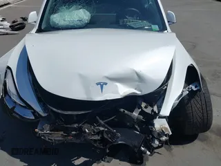 2020 Tesla Model 3 Standard Range Plus with VIN 5YJ3E1EAXLF590591, listed as a IAAI auction lot 42140338 with 79,342 mi miles and . Bid and sale history available at DreamBid. Image 10.