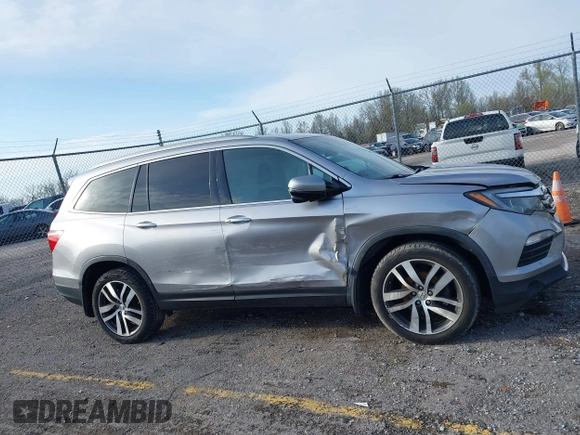 2016 Honda Pilot Touring with VIN 5FNYF6H90GB024902, listed as a IAAI auction lot 41948563 with 148,598 mi miles. Bid and sale history available at carsss.com. Image 13.