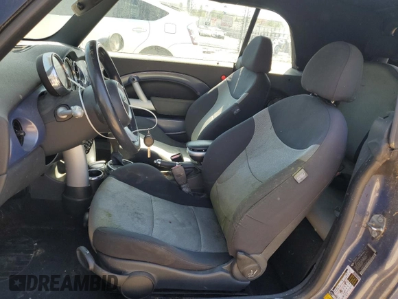 2006 MINI Convertible with VIN WMWRF33556TG14421, listed as a Copart auction lot 50090415 with 136,736 mi miles and Non repairable. Bid and sale history available at DreamBid. Image 7.