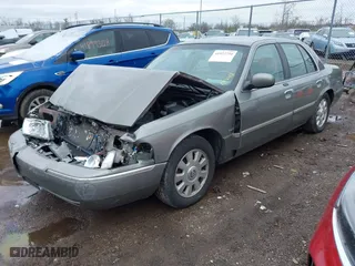 2003 Mercury Grand Marquis LS Premium with VIN 2MEFM75W33X655360, listed as a IAAI auction lot 41922734 with 86,059 mi miles. Bid and sale history available at carsss.com. Image 2.