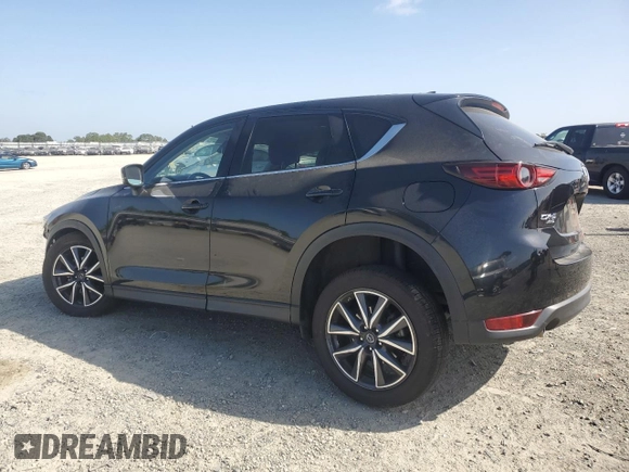 2018 Mazda CX-5 Grand Touring z VIN JM3KFBDM0J0399985, wystawiony jako Copart lot #54097665 z przebiegiem 45 344 mil mil oraz Szkoda całkowita • Salvage title. Historia ofert i sprzedaży dostępna na DreamBid. Obrazek 2.