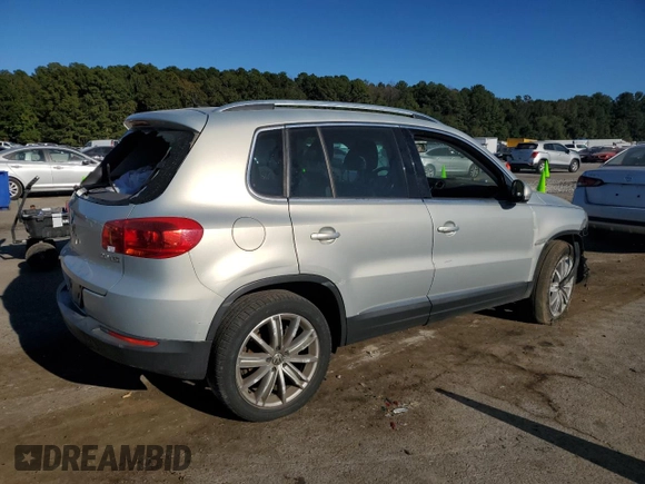 2014 Volkswagen Tiguan SE with VIN WVGAV3AX9EW611860, listed as a Copart auction lot 74431754 with 116,022 mi miles and Salvage title. Bid and sale history available at DreamBid. Image 3.