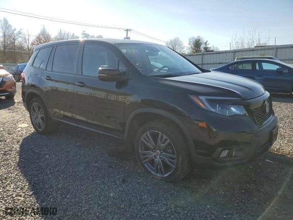 2021 Honda Passport EX-L with VIN 5FNYF8H59MB004250, listed as a Copart auction lot 82094584 with 63,205 mi miles and Salvage Title. Bid and sale history available at carsss.com. Image 4.