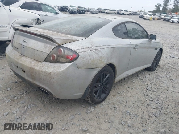 2008 Hyundai Tiburon GS z VIN KMHHM66D68U264666, wystawiony jako IAAI lot #41970123 z przebiegiem 186 448 mil mil oraz . Historia ofert i sprzedaży dostępna na DreamBid. Obrazek 4.