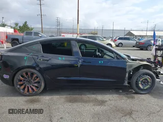 2019 Tesla Model 3 Mid Range with VIN 5YJ3E1EA3KF415601, listed as a IAAI auction lot 42125393 with 150,220 mi miles and . Bid and sale history available at carsss.com. Image 21.