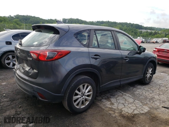 2014 Mazda CX-5 Sport with VIN JM3KE2BE9E0372370, listed as a Copart auction lot 58980165 with 175,477 mi miles and Salvage title. Bid and sale history available at DreamBid. Image 3.