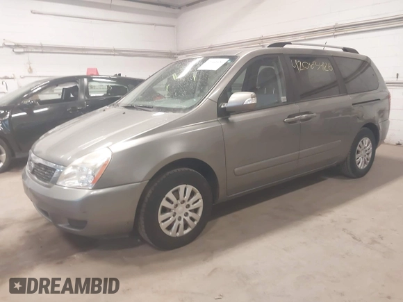 2011 Kia Sedona LX with VIN KNDMG4C78B6363742, listed as a IAAI auction lot 42063426 with 199,828 mi miles. Bid and sale history available at carsss.com. Image 2.