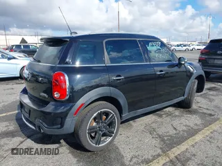 2014 MINI Countryman S with VIN WMWZC3C56EWP27880, listed as a IAAI auction lot 38577048 with 96,812 mi miles and . Bid and sale history available at DreamBid. Image 4.