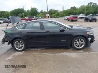 2019 Ford Fusion Hybrid SEL with VIN 3FA6P0MU1KR202860, listed as a IAAI auction lot 41983299 with 133,671 mi miles. Bid and sale history available at carsss.com. Image 14.