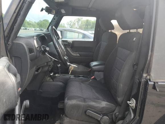 2011 Jeep Wrangler Sport z VIN 1J4GA2D16BL511735, wystawiony jako Copart lot #63292705 z przebiegiem 136 609 mil mil oraz Szkoda całkowita • Salvage title. Historia ofert i sprzedaży dostępna na DreamBid. Obrazek 7.