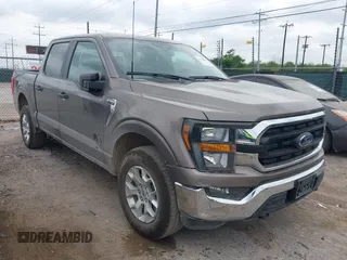 2023 Ford F-150 XL with VIN 1FTFW1E81PFB71702, listed as a IAAI auction lot 42102699 with 57,007 mi miles. Bid and sale history available at carsss.com. Image 1.