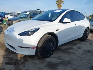 2023 Tesla Model Y Performance with VIN 7SAYGDEF0PF839468, listed as a IAAI auction lot 41609263 with 25,434 mi miles and . Bid and sale history available at DreamBid. Image 2.