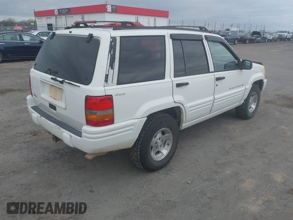 1998 Jeep Grand Cherokee Laredo with VIN 1J4GZ48S3WC204990, listed as a IAAI auction lot 41704176 with 185,376 mi miles. Bid and sale history available at carsss.com. Image 4.