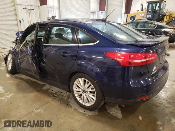 2016 Ford Focus Titanium z VIN 1FADP3J27GL310367, wystawiony jako Copart lot #55048005 z przebiegiem 86 676 mil mil oraz Szkoda całkowita • Salvage title. Historia ofert i sprzedaży dostępna na DreamBid. Obrazek 2.