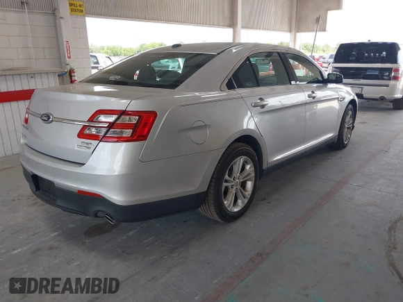 2014 Ford Taurus SEL z VIN 1FAHP2E82EG139690, wystawiony jako IAAI lot #42312483 z przebiegiem 170 029 mil mil oraz . Historia ofert i sprzedaży dostępna na DreamBid. Obrazek 4.