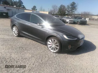2016 Tesla Model X P90D with VIN 5YJXCBE43GFS00850, listed as a IAAI auction lot 41613006 with 125,960 mi miles. Bid and sale history available at carsss.com. Image 1.