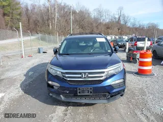 2017 Honda Pilot EX-L with VIN 5FNYF5H52HB031634, listed as a IAAI auction lot 41145133 with 164,668 mi miles. Bid and sale history available at carsss.com. Image 12.