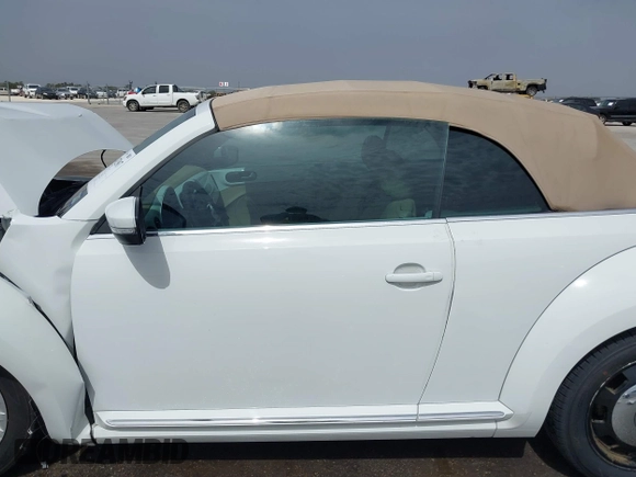 2015 Volkswagen Beetle 1.8T w/Tech with VIN 3VW517AT4FM812294, listed as a IAAI auction lot 41753967 with 59,857 mi miles and . Bid and sale history available at DreamBid. Image 14.
