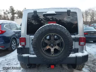2015 Jeep Wrangler Unlimited Rubicon Hard Rock with VIN 1C4HJWFG1FL659803, listed as a IAAI auction lot 41172485 with 126,881 mi miles. Bid and sale history available at carsss.com. Image 16.