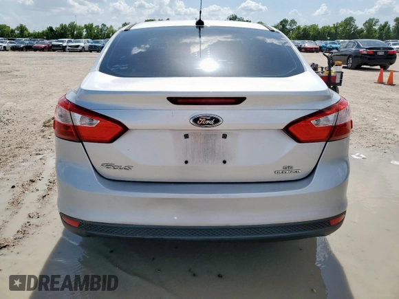 2013 Ford Focus SE with VIN 1FADP3F22DL263124, listed as a Copart auction lot 61583795 with 133,522 mi miles and Salvage title. Bid and sale history available at DreamBid. Image 6.