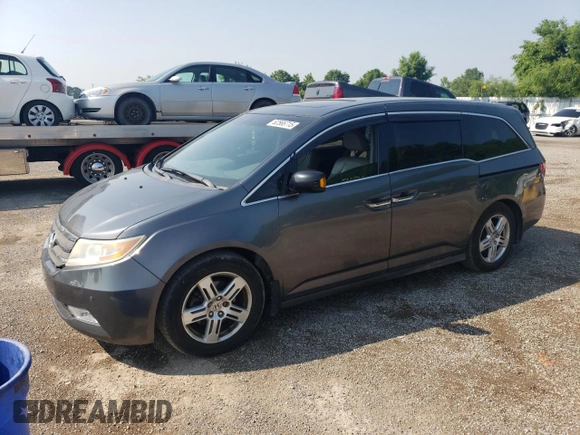 2012 Honda Odyssey Touring with VIN 5FNRL5H90CB505590, listed as a Copart auction lot 62566715 with 323,092 mi miles and Clean title. Bid and sale history available at DreamBid. Image 1.