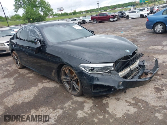 2019 BMW 5 Series M550i xDrive z VIN WBAJB9C53KB464754, wystawiony jako IAAI lot #42116407 z przebiegiem 156 418 mil mil oraz . Historia ofert i sprzedaży dostępna na DreamBid. Obrazek 1.