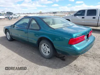 1997 Ford Thunderbird LX with VIN 1FALP62W7VH153454, listed as a IAAI auction lot 41833472 with 147,269 mi miles and . Bid and sale history available at DreamBid. Image 3.