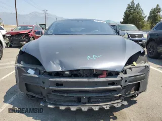 2014 Tesla Model S 60 z VIN 5YJSA1H11EFP64764, wystawiony jako Copart lot #64265815 z przebiegiem 126 191 mil mil oraz Szkoda całkowita • Salvage title. Historia ofert i sprzedaży dostępna na DreamBid. Obrazek 5.